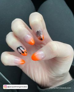 Bright Orange And Black Nails In French Tip Design