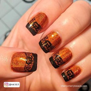 Burnt Orange And Black Nails With Glitter