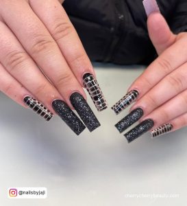 Coffin Black Glitter Nails With Line Design On Two Fingers