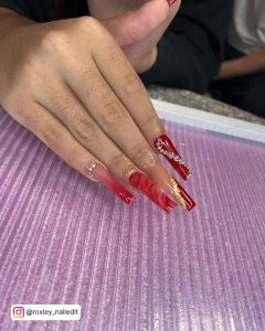Coffin Red And Gold Nails