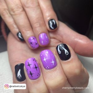 Cute Black And Purple Nails With Stars