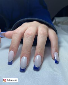 Dark Blue French Tip Nails With White Base Coat