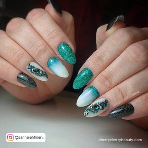 Emerald Green And Black Nails With Embellishments
