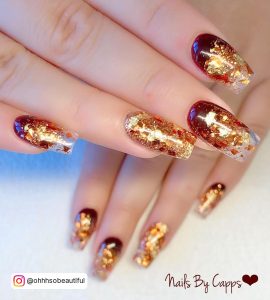 Gold French Tip Coffin Nails