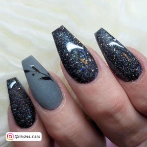 Gray And Black Acrylic Nails With Design On One Finger
