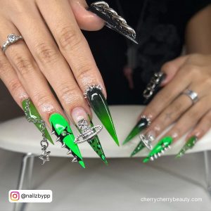 Green And Black Acrylic Nails With Embellishments