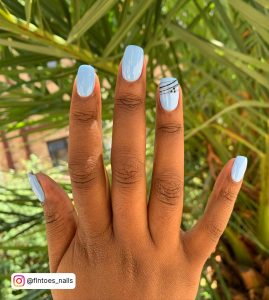 Light Blue Acrylic Nails With Design On Ring Finger