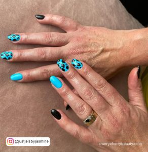 Light Blue And Black Acrylic Nails With Spots