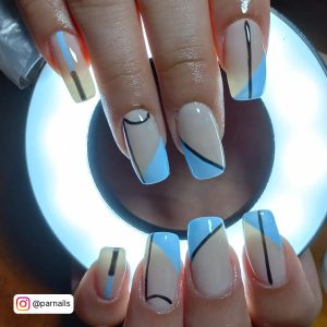 Light Blue And Black Nails With Abstract Design
