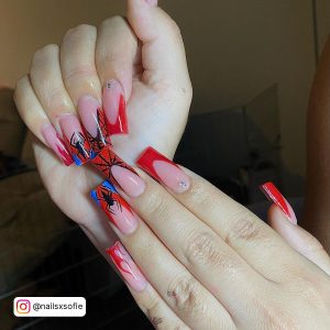 Light Blue And Red Nails With Spiders And Webs