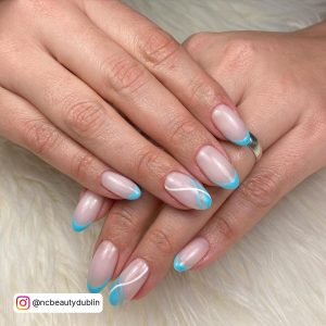 Light Blue French Tip Nails Almond With Swirls