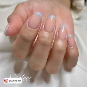 Light Blue Nail Tips With Nude Base Coat