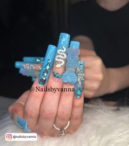 Light Blue Nails With Design And Embellishments