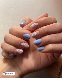 Light Blue Nails With Designs Of Stems