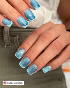 Light Blue Nails With Glitter For A Winter Effect