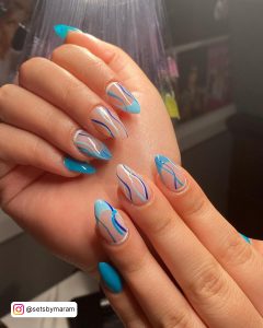 Light Blue Swirl Nails In Almond Shape