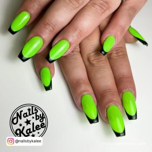 Light Green And Black Nails In French Tip Design