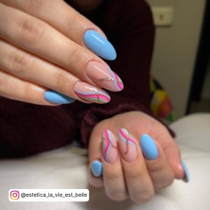 Light Pink And Blue Nails With Swirls