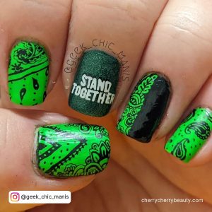 Lime Green And Black Nails With Stand Together Slogan