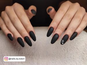 Long Black Matte Nails With M On Ring Finger