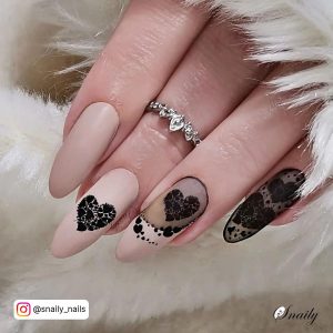 Matte Black And Nude Nails With Hearts
