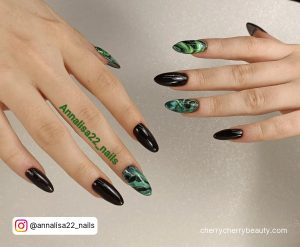 Mint Green And Black Nails With Marble Pattern