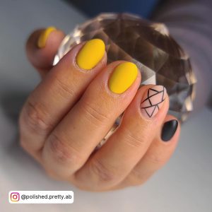 Mustard Yellow And Black Nails With Abstract Lines On Ring Finger