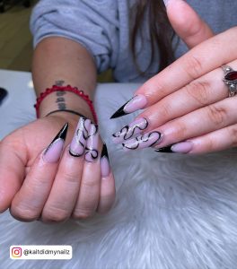 Nails With Black Swirls In Stiletto Shape