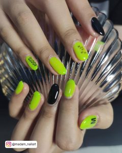 Neon Green And Black Nails In Almond Shape
