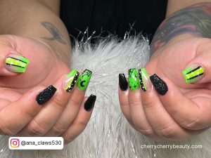 Neon Green And Black Nails With Glitter