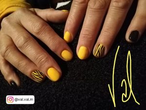Neon Yellow And Black Nails With Lines