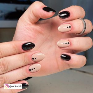 Nude And Black Almond Nails With Dots