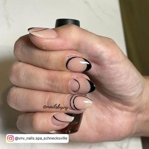Nude And Black Nail Designs In Almond Shape