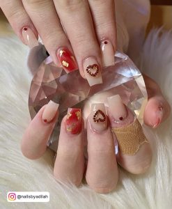 Nude Nails With Red Designs