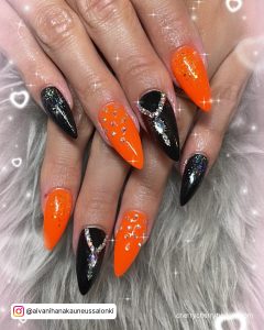 Orange And Black Gel Nails With Diamonds
