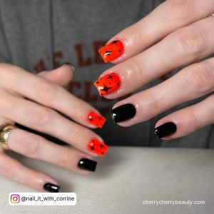 Orange And Black Nails Design With Stars