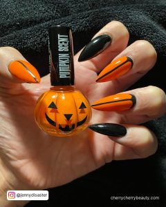 Orange And Black Nails For Halloween In Stiletto Shape