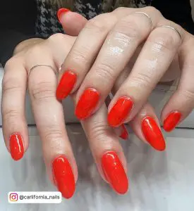 Orange Red Nails With Glitter