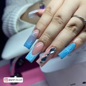 Pink And Blue Ombre Nails With Rhinestones And Snowflakes