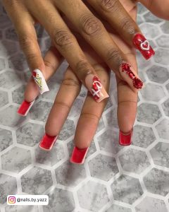 Pink Stiletto Nails With Red Rhinestones