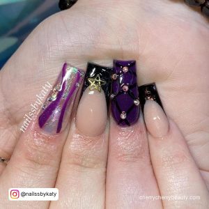 Purple And Black Halloween Nails With Stars