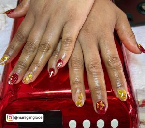 Red And Gold Chrome Nails
