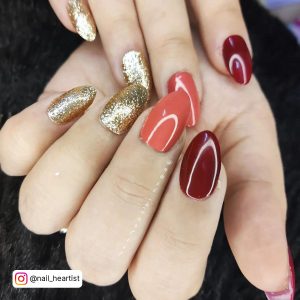 Red And Gold Marble Nails