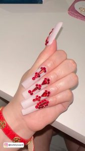 Red Nail Design With Diamonds