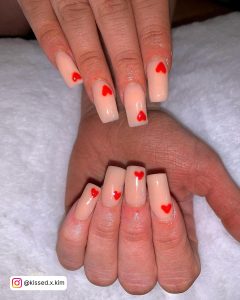 Red Nails With Heart Designs