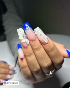 Royal Blue And White Coffin Nails With Flowers And Diamonds