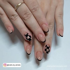 Short Black Almond Nails With Check Pattern On Two Fingers