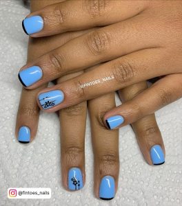 Short Sky Blue Nails With Design On Ring Finger