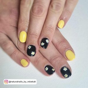 Simple Black And Yellow Nails With White Flowers