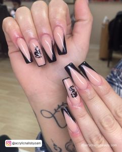 Simple Black Tip Nails With Design On Ring Finger
